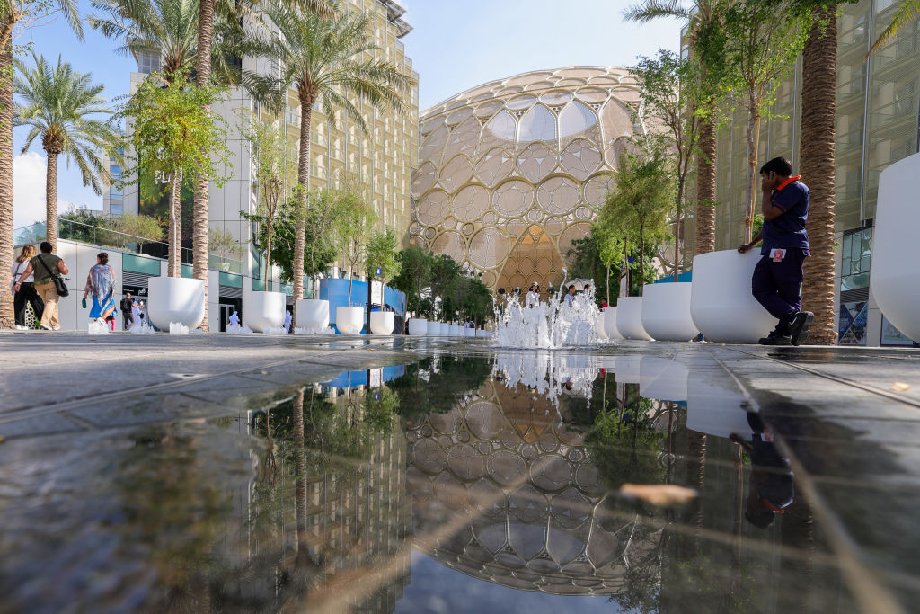 A worker speaks on his mobile phone at the venue of the COP28 United Nations climate summit in Dubai on 29 November.