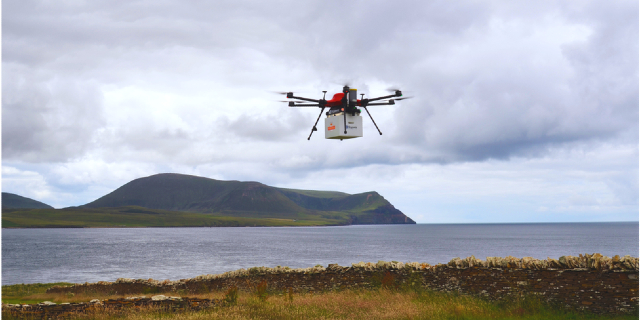 A drone made by Royal Mail and Skyports is seen carrying post above the Orkney islands