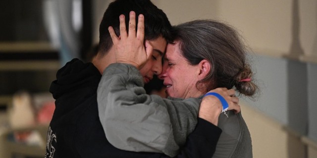 Sharon Avigdori embraces her son Omer after her release from Gaza