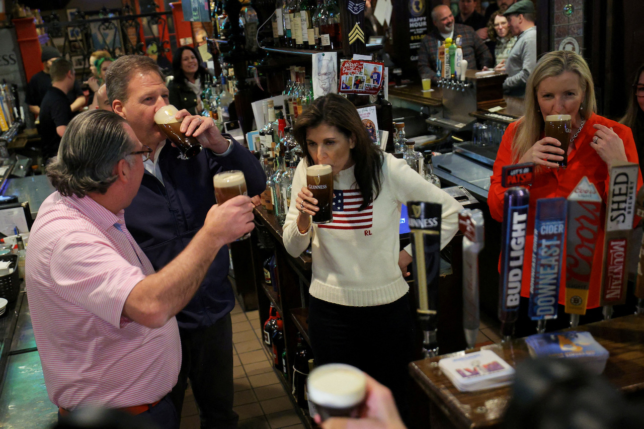 Nikki Haley drinks a beer in New Hampshire