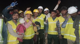 Workers smile as they pose for a photograph after their rescue from inside the Silkyara tunnel in Uttarkashi in India