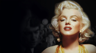 Marilyn Monroe looks into the camera. She is wearing a gold sparkly dress, earrings with red lipstick and full make-up. Behind her in black and white shadowy male figures can be seen