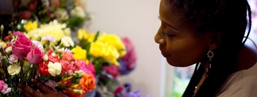 BBC producer Kamilah McInnes holding a bunch of flowers