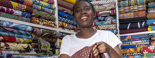 A woman in a wax print shop in Ghana