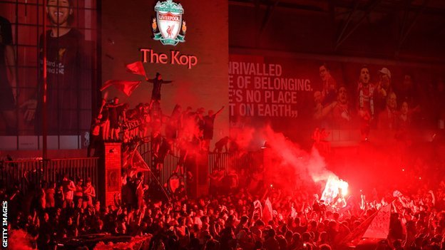 Liverpool fans set off flares outside Anfield