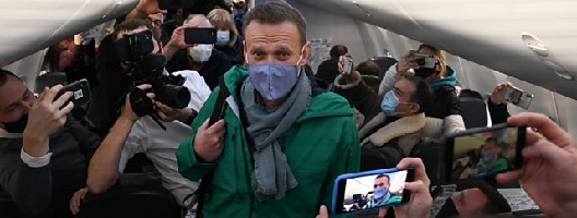 Alexei Navalny being photographed on a plane