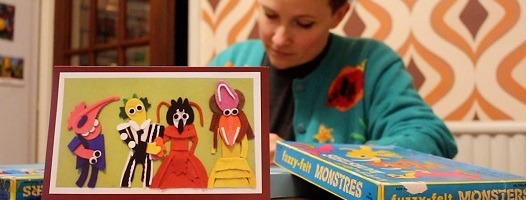 Lucy Morrow works behind one of her Fuzzy Felt creations