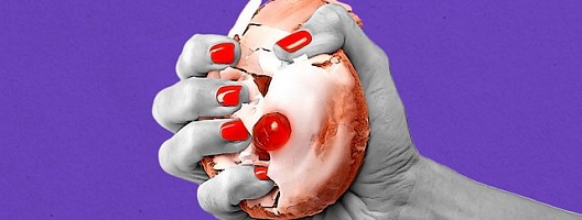 A hand crushing a Belgian bun