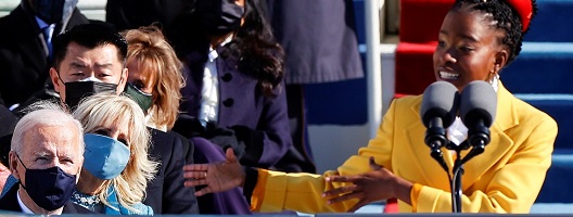 Joe Biden watches poet Amanda Gorman recite her work at his inauguration