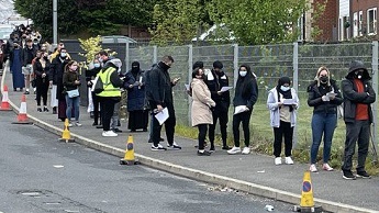 Queues at a vaccination centre in Bolton