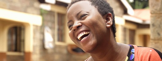 A woman looking away from the camera and laughing