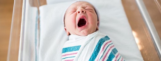 A baby yawning