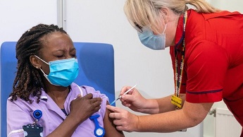 A nurse receives a Covid-19 booster jab in September 2021