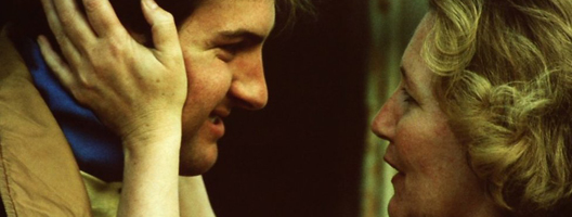 Tim Rees's mother cups his face in her hands