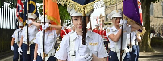 Young female loyalist band prepares to take part in the annual Relief of Derry march on August 14, 2021. (Charles McQuillan/Getty Images)