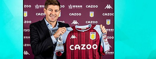 Steven Gerrard holds up an Aston Villa shirt