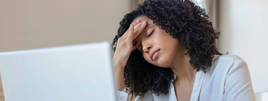 A woman holding her head