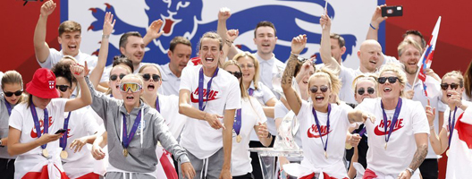 The England women's football team celebrate their victory in London's Trafalgar Square