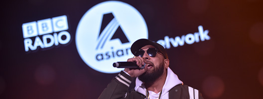 Singer Imran Khan, in front of the Asian Network logo, at Asian Network Live, in 2018