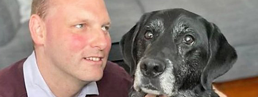 BBC correspondent Sean Dilley, with guide dog Sammy