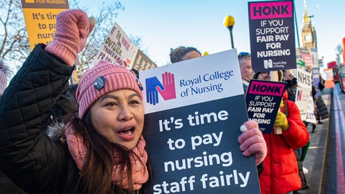 A nurse holding a placard during the strike, in London, on 15 December 