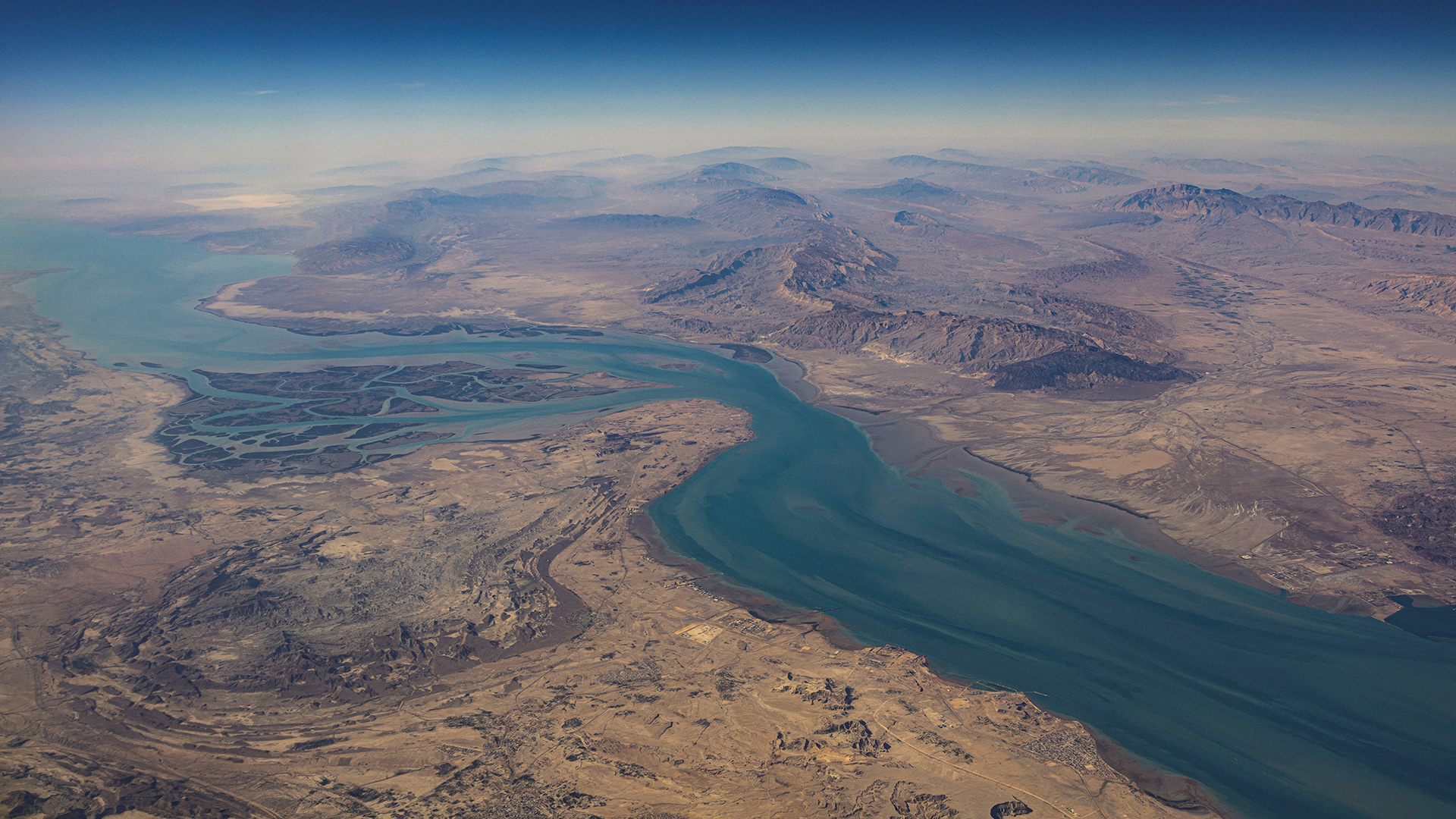 An aerial view of the Iranian shores and the island of Qeshm in the strait of Hormuz, December 10, 2023 (Credit: Nicolas Economou/Reuters)