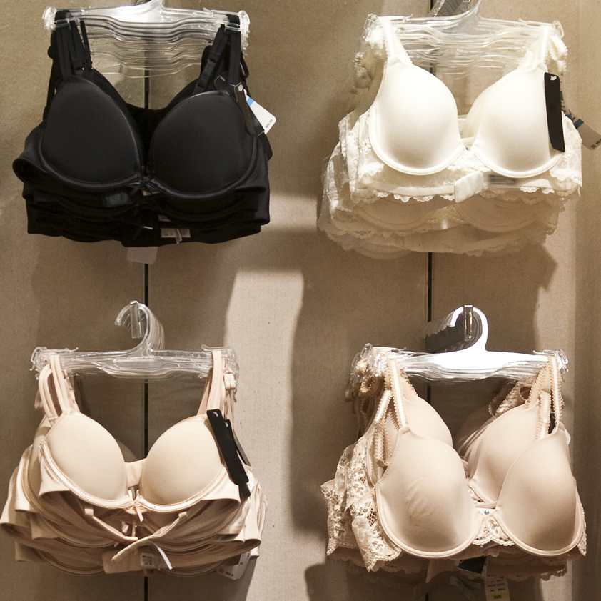 A selection of bras on sale in a store (Credit: Getty Images)
