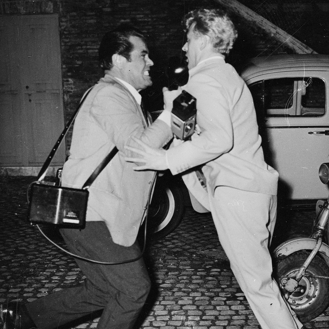 English rock'n'roll star Willie Harris brawls with a persistent press photographer on the Via Veneto in Rome in 1962 (Credit: Keystone Features/Getty Images)